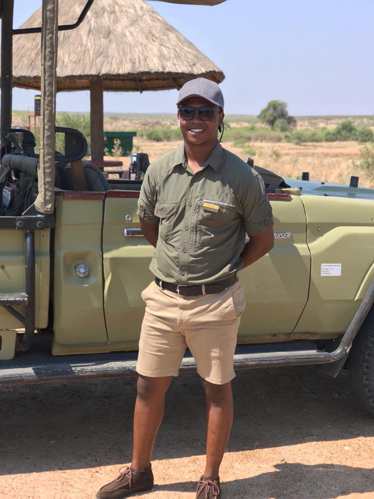 Steve in front of a safari jeep